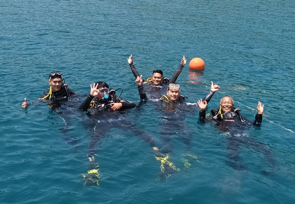 A group of tourists are pictured on their diving trip in the Hon Mun Marine Reserve.