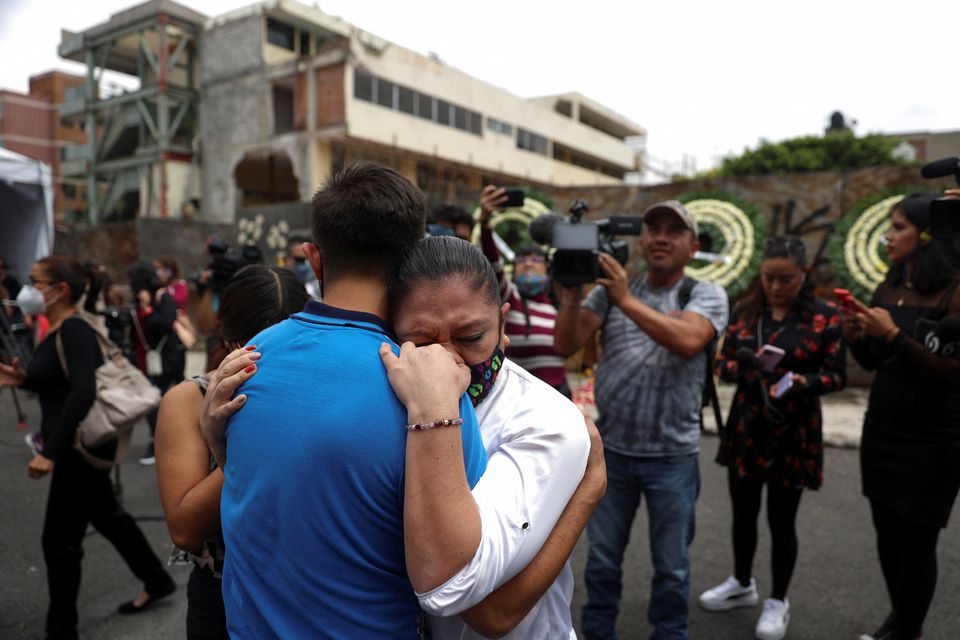 People attending an event to honor the children who died in the Enrique Rebsamen school during an earthquake in 2017, embrace as another earthquake is felt in Mexico City, Mexico, September 19, 2022. Photo: Reuters