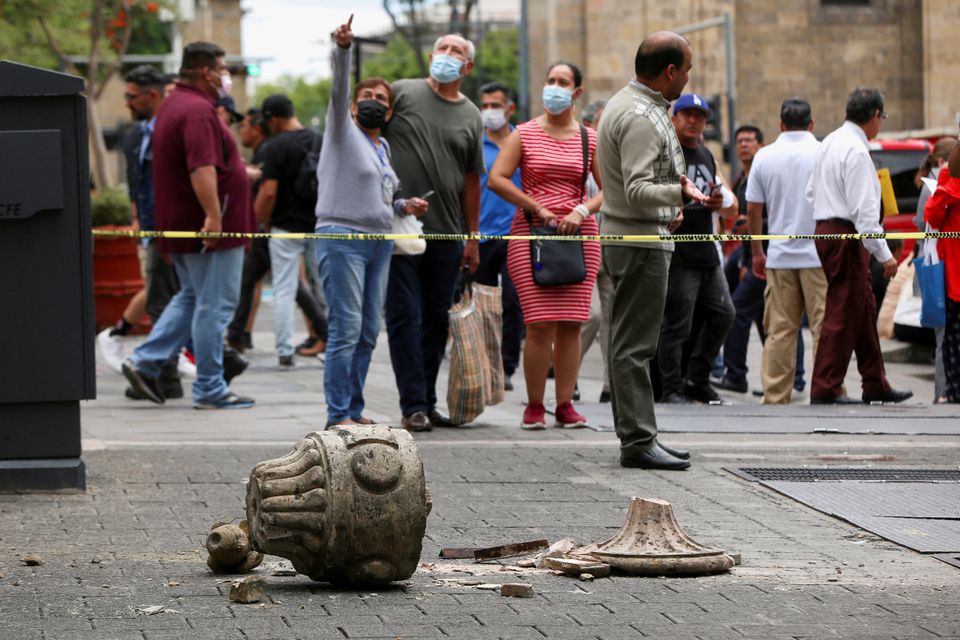 People gesture at an area cordoned off by police after an ornament fell off from a church during an earthquake, in Guadalajara, Mexico September 19, 2022. Photo: Reuters