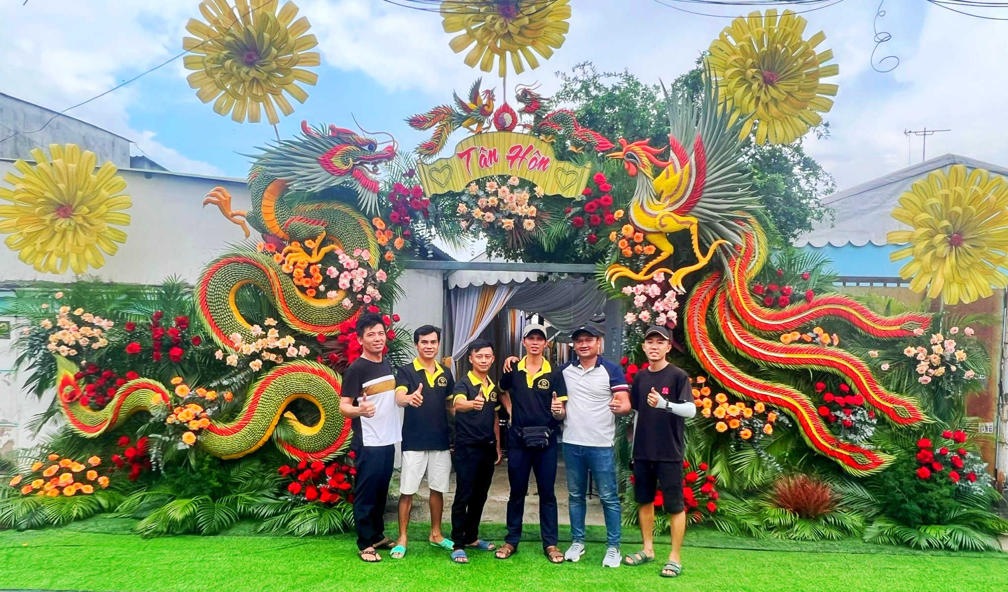 A supplied photo shows Tran Trung Hieu (first on left) and his team posing with a complete wedding gate in District 12, Ho Chi Minh City.