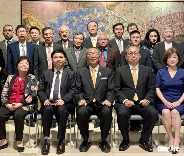 Doctor Tadashi (first row, center) poses for a photo with guests at a ceremony to congratulate him on receiving the Ramon Magsaysay Award on Wednesday. Photo: Duy Linh / Tuoi Tre