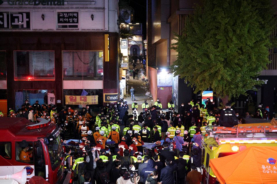 Rescue team and firefighters work at the scene where dozens of people were injured in a stampede during a Halloween festival in Seoul, South Korea, October 30, 2022. Photo: Reuters