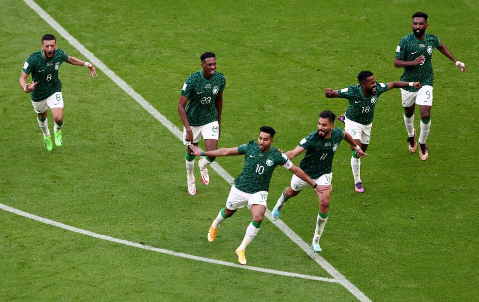 Soccer Football - FIFA World Cup Qatar 2022 - Group C - Argentina v Saudi Arabia - Lusail Stadium, Lusail, Qatar - November 22, 2022 Saudi Arabia's Salem Al-Dawsari celebrates scoring their second goal with teammates. Photo: Reuters