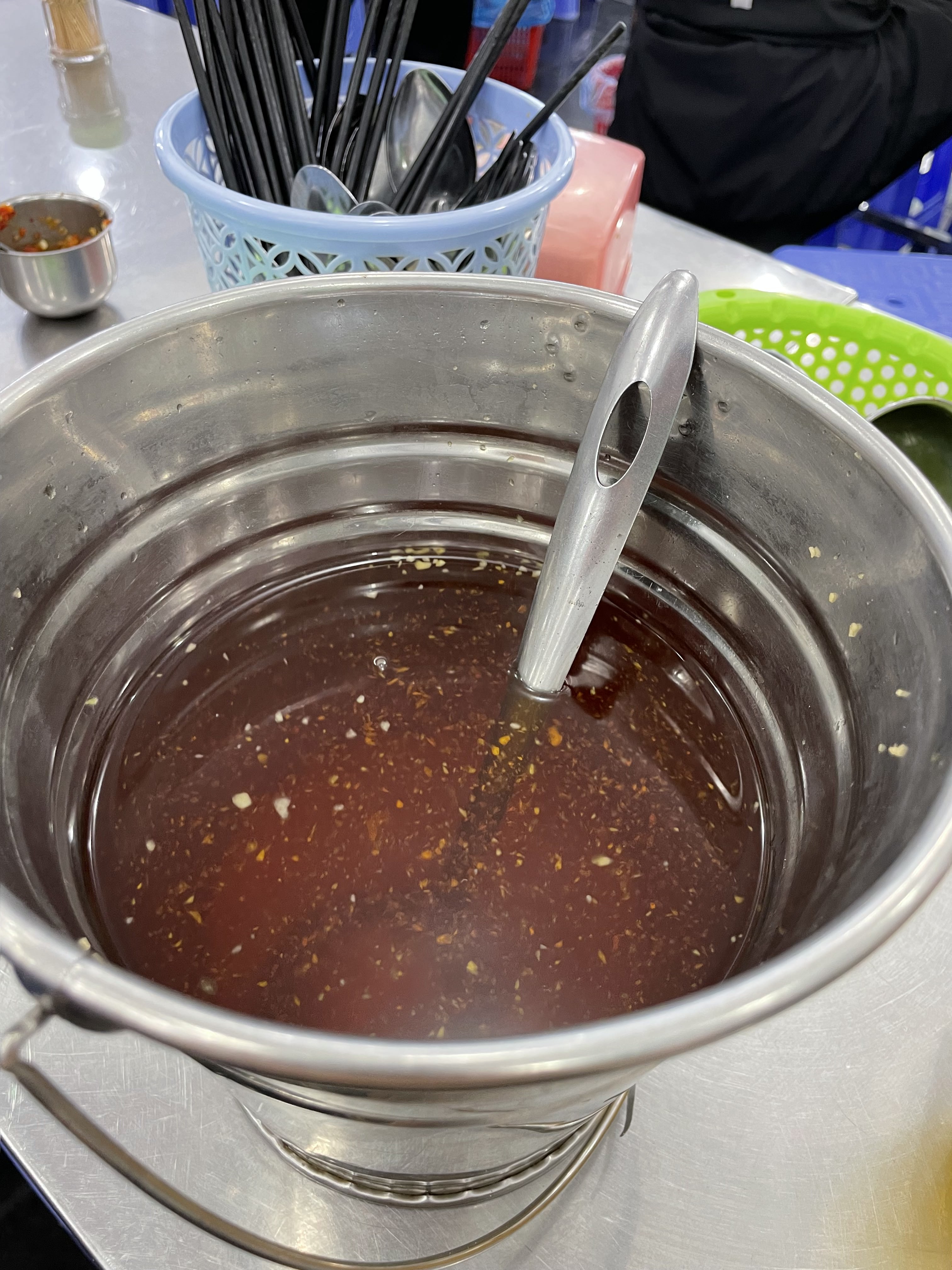 A bucket of sweet and sour fish sauce seen at Kieu Bao, a 'bún thịt nướng' restaurant with six branches across Ho Chi Minh City. Photo: Cassanda Cassidy / Tuoi Tre News