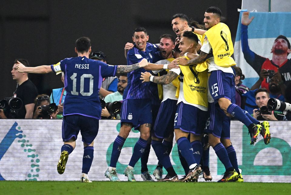 Soccer Football - FIFA World Cup Qatar 2022 - Group C - Poland v Argentina - Stadium 974, Doha, Qatar - November 30, 2022 Argentina's Alexis Mac Allister celebrates scoring their first goal with Angel Di Maria and Lionel Messi. Photo: Reuters