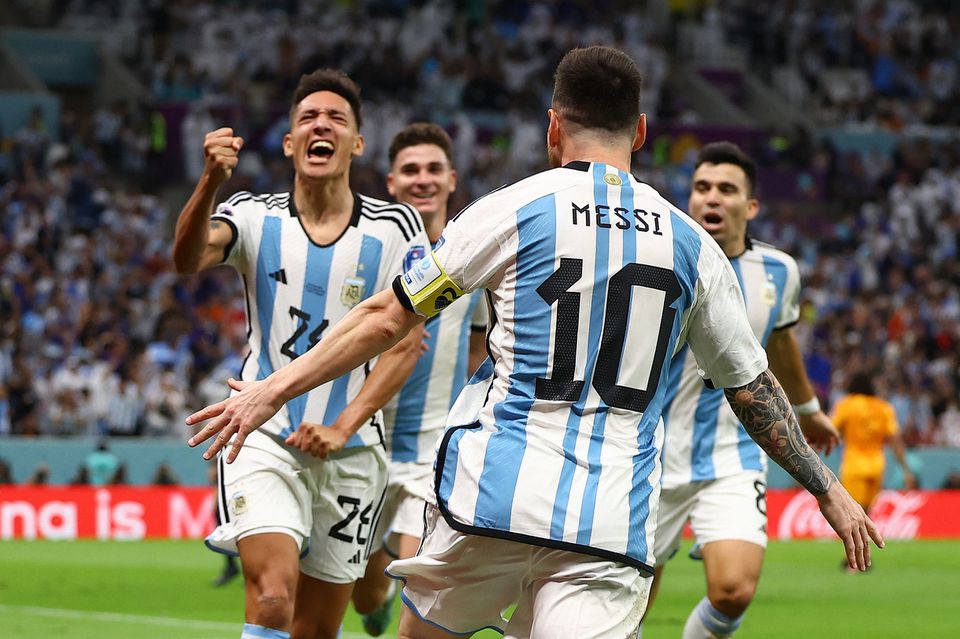 Soccer Football - FIFA World Cup Qatar 2022 - Quarter Final - Netherlands v Argentina - Lusail Stadium, Lusail, Qatar - December 9, 2022 Argentina's Nahuel Molina celebrates scoring their first goal with Lionel Messi REUTERS/Kai Pfaffenbach