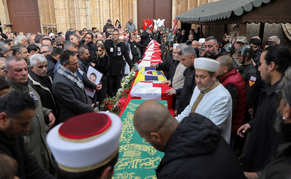 Coffins of Turkish Cypriot high school students, victims in a deadly earthquake in Turkey, are seen during a funeral in Famagusta, in Turkish-controlled northern Cyprus, February 10, 2023. Photo: Reuters