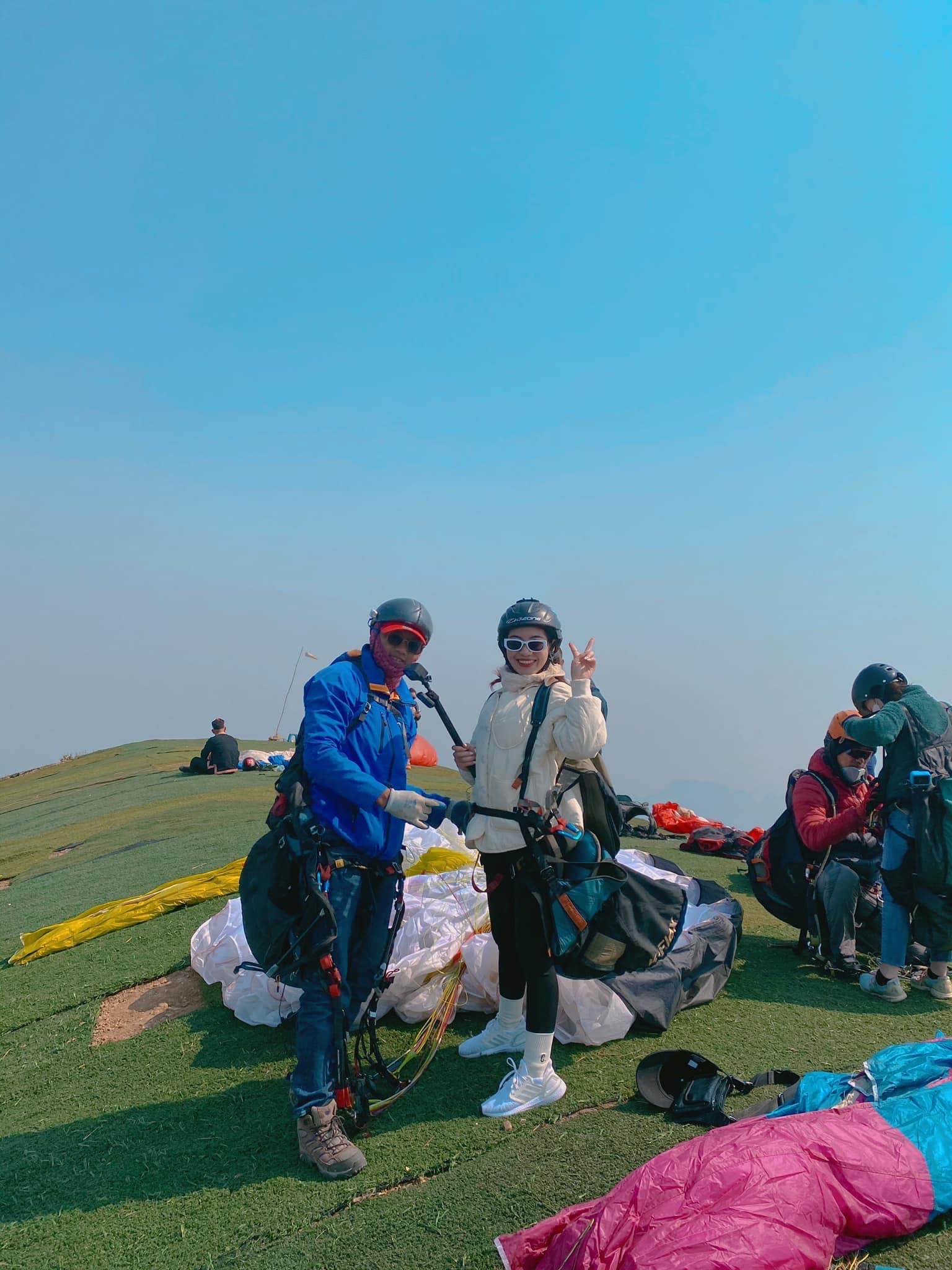 A tourist poses before taking off for paragliding at Bu Hill on the outskirts of Hanoi, Vietnam. Photo by courtesy of Mebayluon