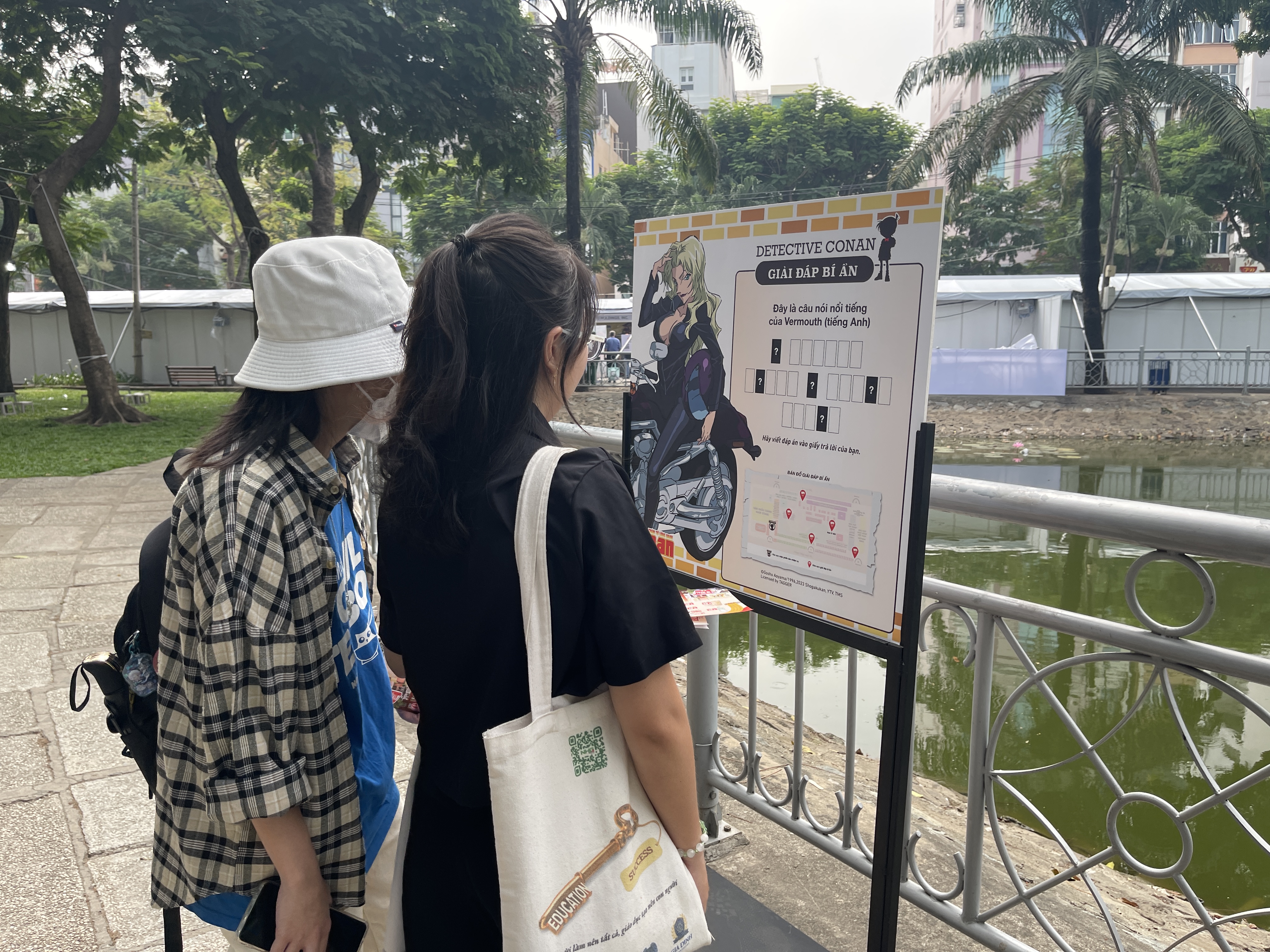 Festival-goers look at a puzzle from the famous Japanese comic series Detective Conan at the Japan Vietnam Festival in Ho Chi Minh City on February 25, 2023. Photo: Dong Nguyen / Tuoi Tre News