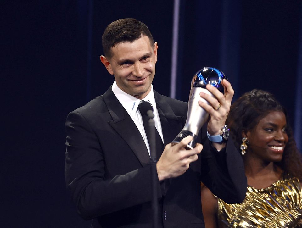 Soccer Football - The Best FIFA Football Awards - Salle Pleyel, Paris, France - February 27, 2023 Aston Villa's Emilio Martinez receives the Best Goalkeeper award from Enjola Aluko during the Best FIFA Football Awards. Photo: Reuters