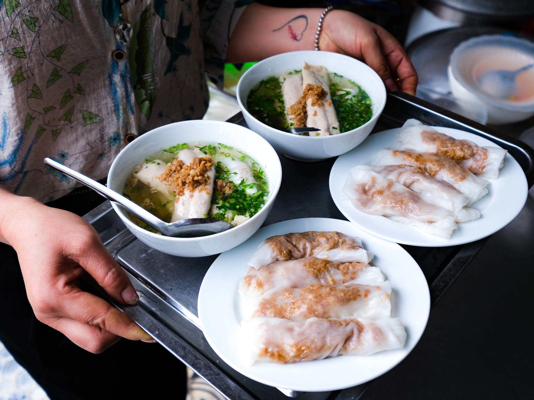 Portions of banh cuon are ready to serve at Banh Cuon Cao Bang stall in Hanoi, Vietnam. Photo: Nam Tran / Tuoi Tre News