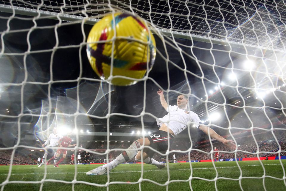 Soccer Football - Premier League - Liverpool v Manchester United - Anfield, Liverpool, Britain - March 5, 2023 Liverpool's Mohamed Salah scores their sixth goal past Manchester United's Diogo Dalot. Photo: Reuters