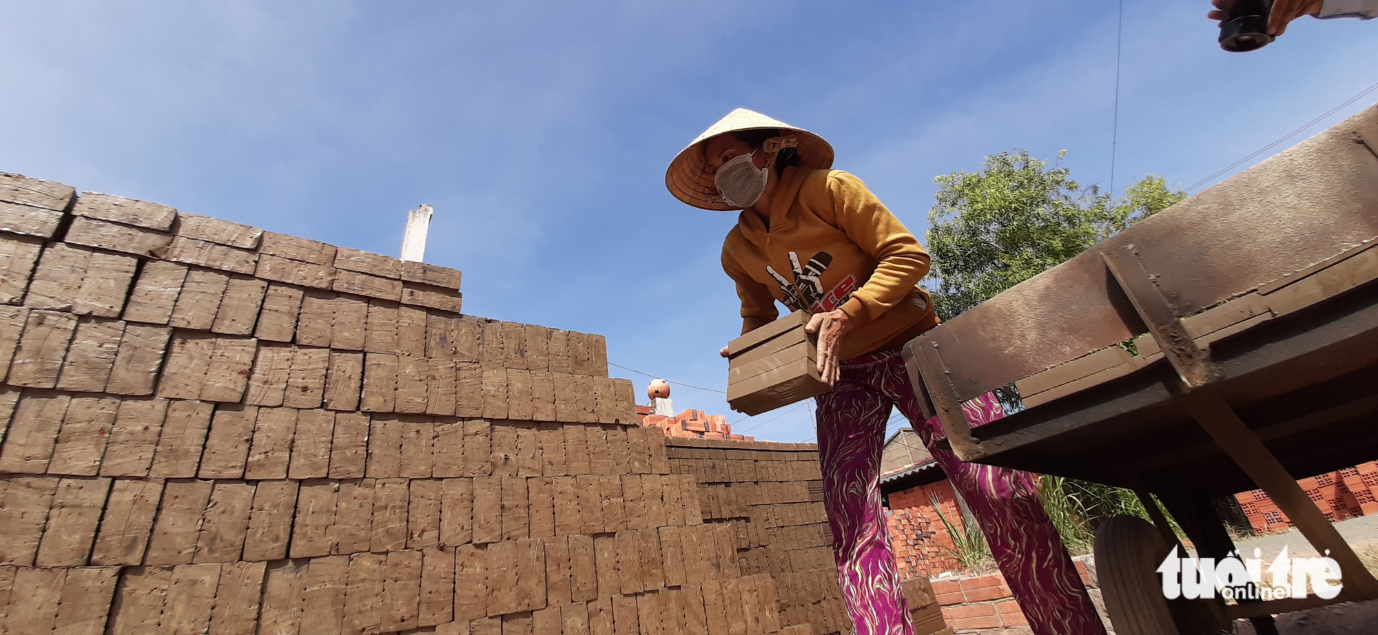 Blocks molded in clay are sunbathed before being put into a kiln for burning