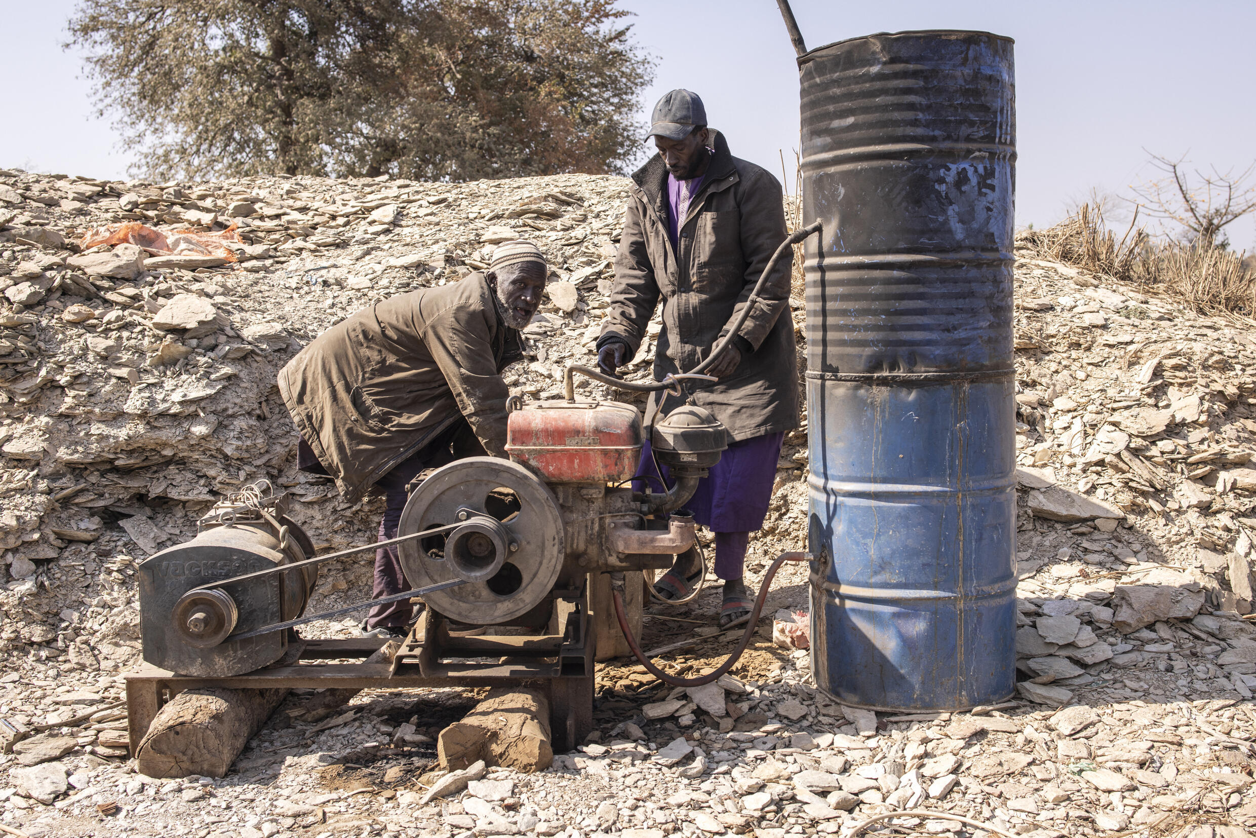 Artisanal gold miners pump water out of the deep tunnels at the Bantakokouta gold mine on February 2, 2023. Photo: AFP