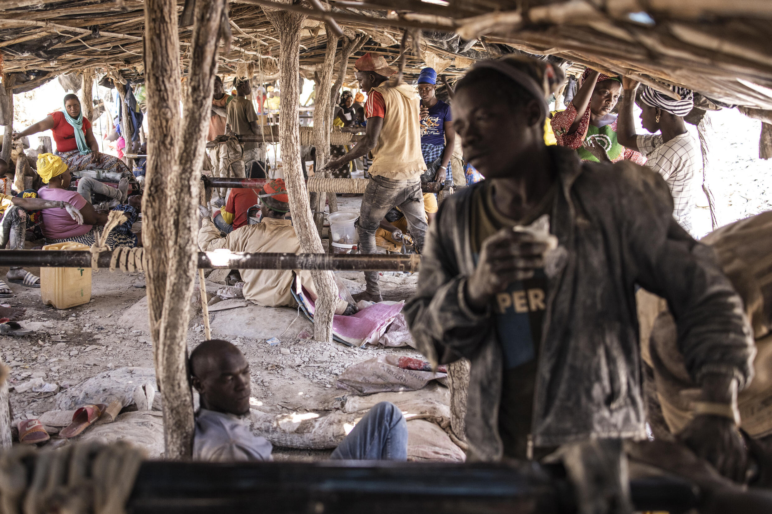 Artisanal gold miners cross The Gambia river at the Bantakokouta gold mine on February 2, 2023. Photo: AFP