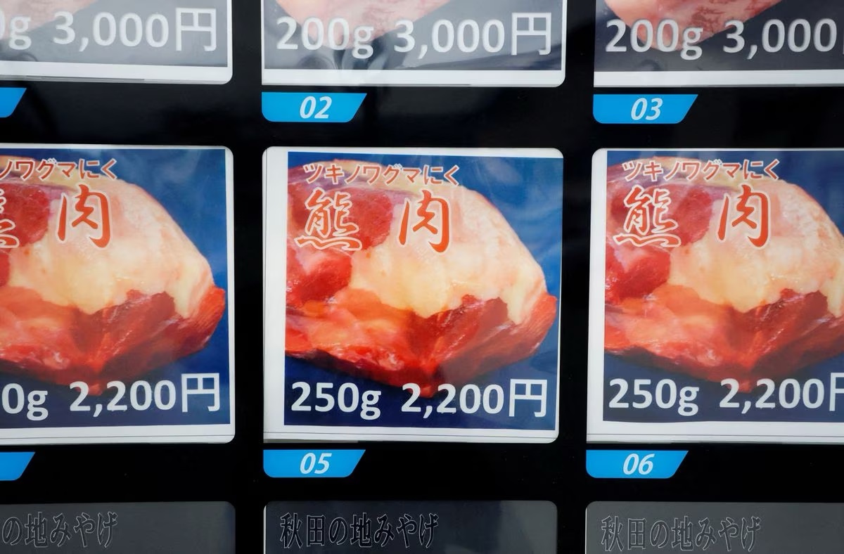 A display screen of a vending machine for placing the order for Asian Black Bear meat is seen in front of a soba noodle restaurant in Semboku, Akita prefecture, Japan, April 6, 2023. Photo: Reuters