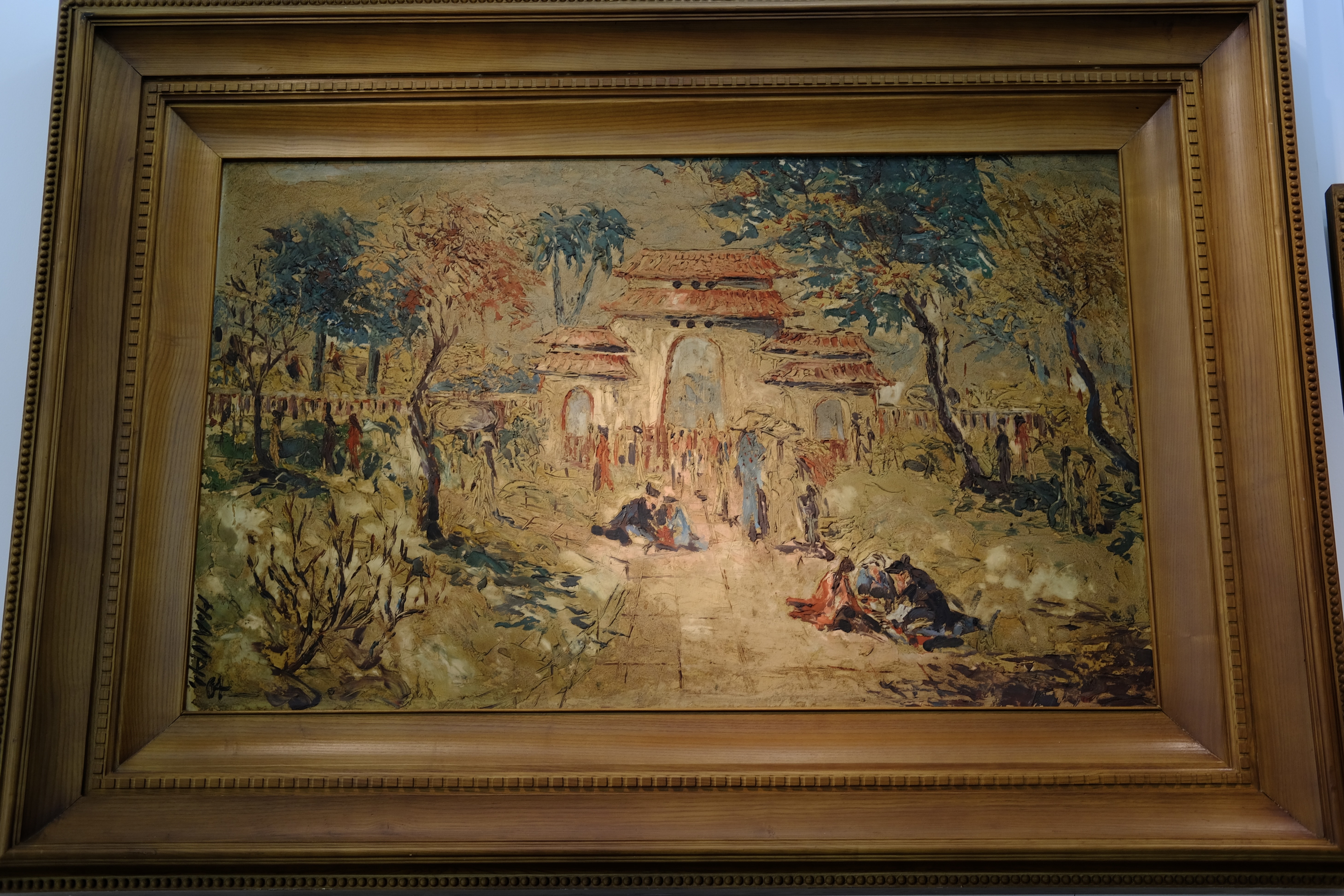 An oil painting titled “Lang Ong Ba Chieu” by H. ANAM. Photo: Phuong Tran / Tuoi Tre News