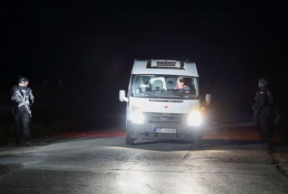 Security forces operate as an ambulance passes through a checkpoint during the aftermath of a shooting, in Dubona, Serbia, May 5, 2023. Photo: Reuters