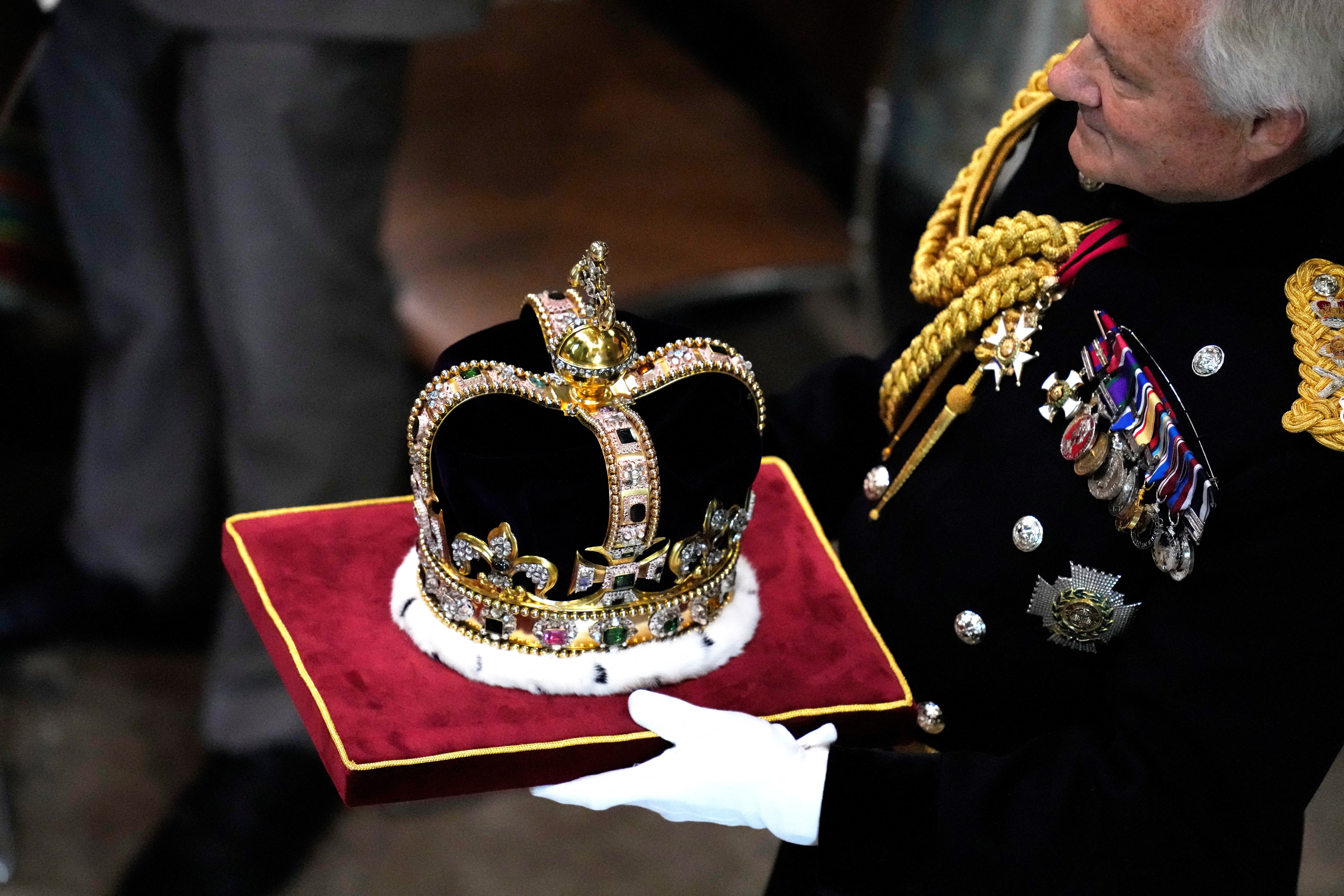 St Edward's Crown is carried during the coronation ceremony of Britain's King Charles III at Westminster Abbey in London Saturday, May 6, 2023. Photo: Reuters