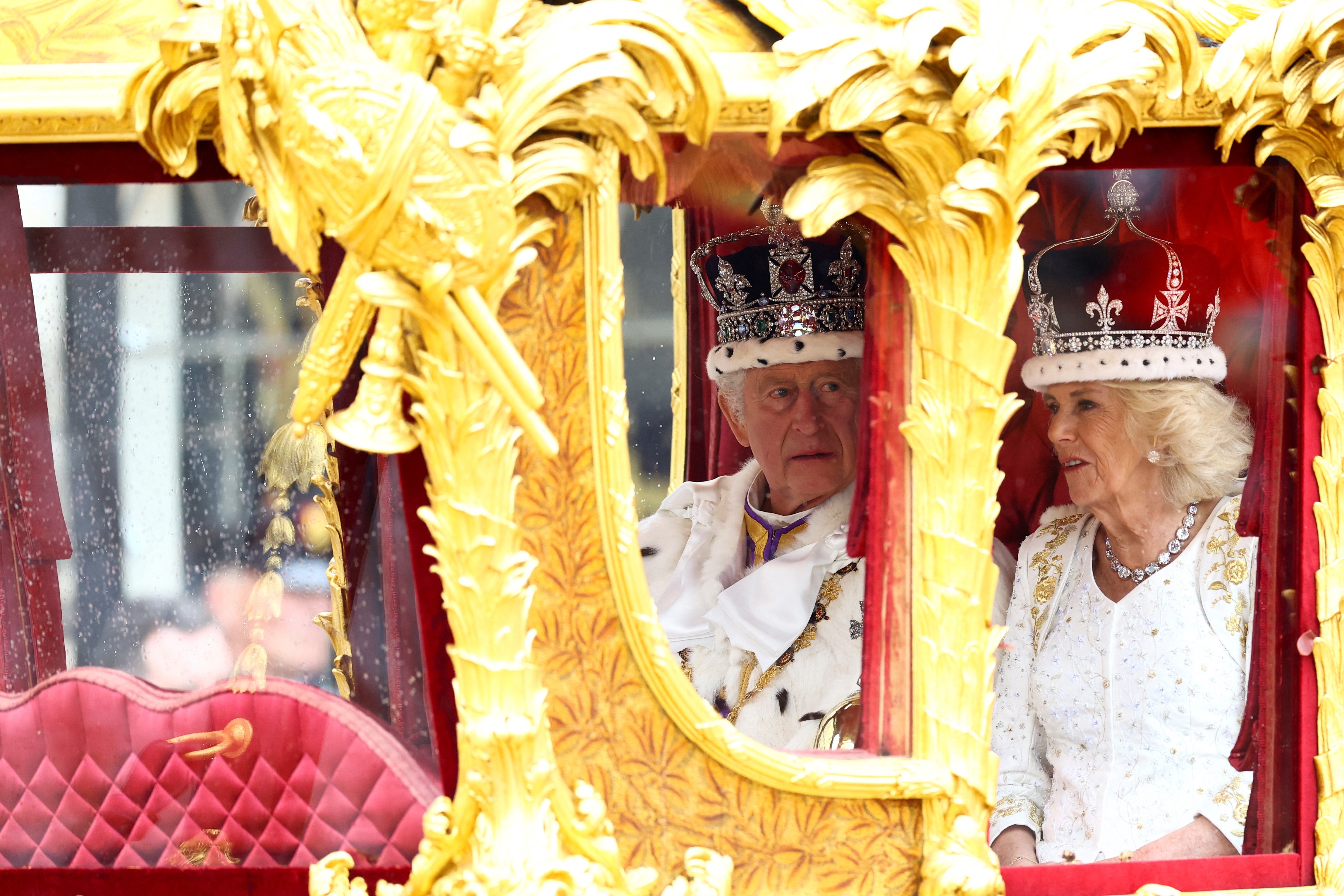 Britain's King Charles and Queen Camilla travel from Westminster Abbey in the Gold State Coach, following their coronation ceremony, in London, Britain May 6, 2023. Photo: Reuters