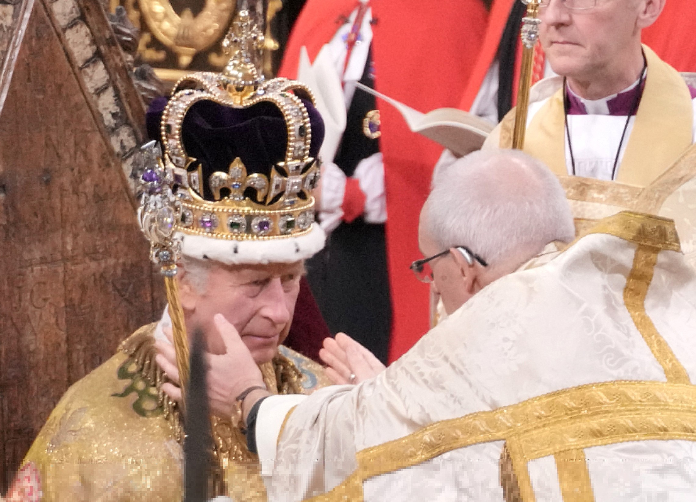 King Charles III receives The St Edward's Crown during his coronation ceremony in Westminster Abbey, London. Picture date: Saturday May 6, 2023. Photo: Reuters