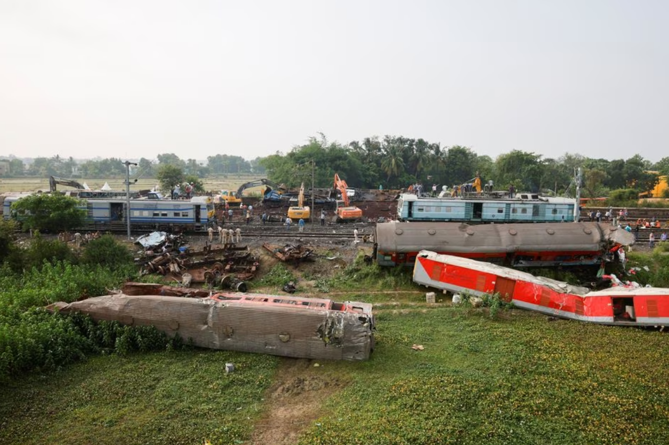 A passenger train hit a stationary freight train, went off the tracks and hit another passenger train passing in the opposite direction near the district of Balasore in the eastern state of Odisha, killing at least 275 people on June 2, 2023. Photo: Reuters