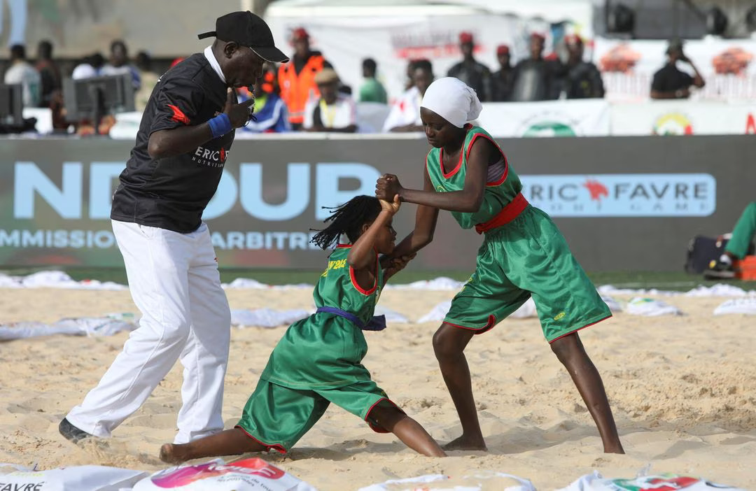 [2/5] Female wrestlers trained by Shogo Uozumi attend a wrestling tournament at the Mawade Wade Stadium in Saint Louis, Senegal, May 13, 2023. Photo: Reuters