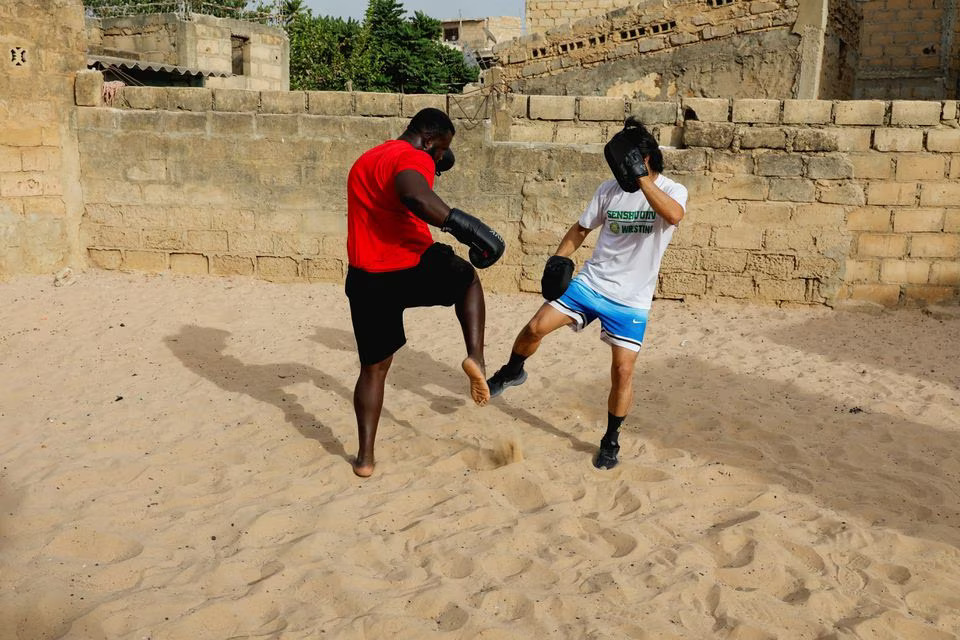[5/5] Shogo Uozumi, also known as Songo Tine, 29 years old, trains with his teammates at the Samba Dia stable in the Diakhao neighbourhood, in Thies, Senegal, May 26, 2023. Photo: Reuters