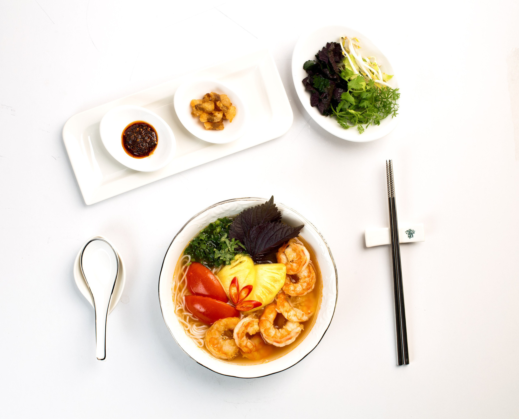 A supplied photo shows a bowl of 'bún tôm' (shrimp vermicelli soup) produced by PQ Foods.