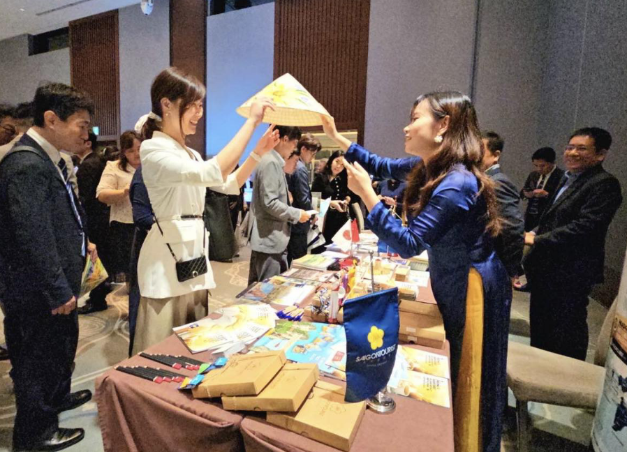 Representatives of Japanese firms learn about products and services at a booth at the event. Photo: X.T. / Tuoi Tre