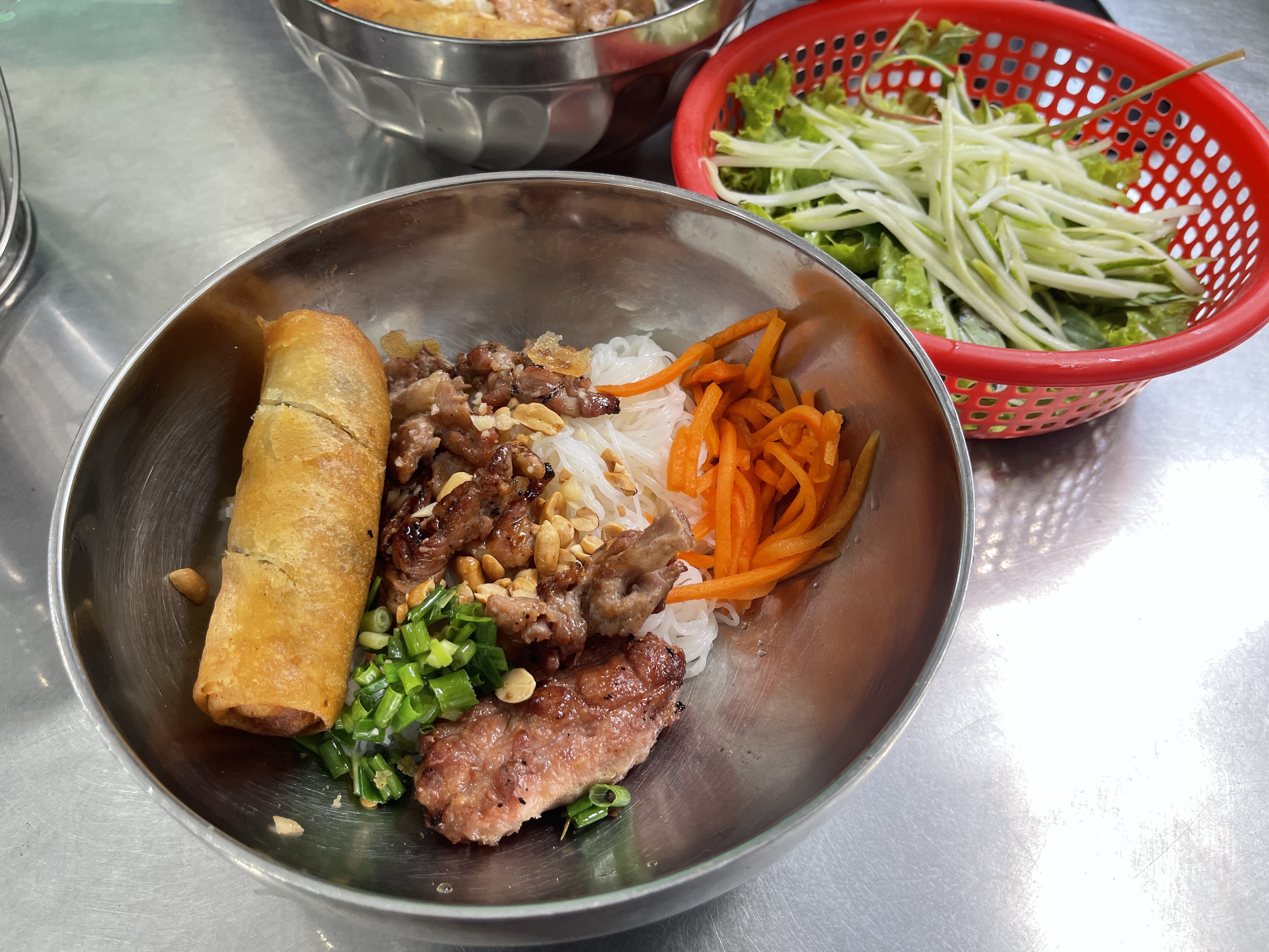 A bowl of 'bun thit nuong' (noodles topped with grilled pork) is served at an eatery in Tan Phu District, Ho Chi Minh City. Photo: Dong Nguyen / Tuoi Tre News
