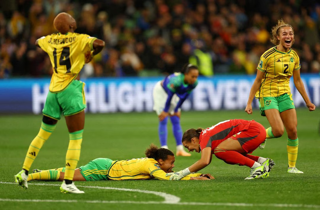 Jamaica's Solai Washington and Rebecca Spencer celebrate after their match against Brazil as Jamaica qualify for the knockout stages. Photo: Reuters