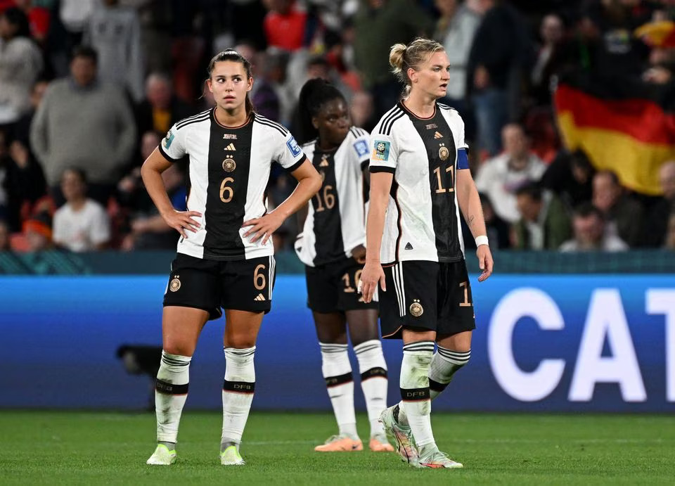 Soccer Football - FIFA Women’s World Cup Australia and New Zealand 2023 - Group H - South Korea v Germany - Brisbane Football Stadium, Brisbane, Australia - August 3, 2023. Germany's Lena Oberdorf, Nicole Anyomi and Alexandra Popp look dejected after Germany are knocked out of the World Cup. Photo: Reuters