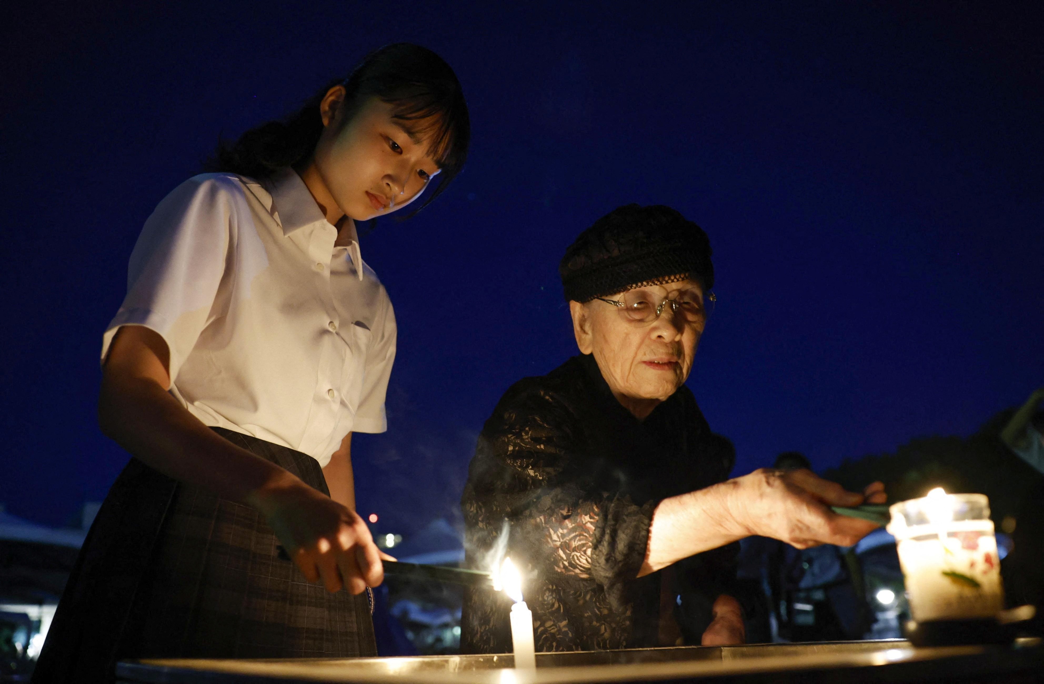 People burn incense sticks before praying for the victims of the U.S. 1945 atomic bombing, at the Peace Memorial Park in Hiroshima, western Japan, in this photo taken by Kyodo on August 6, 2023. Photo: Reuters
