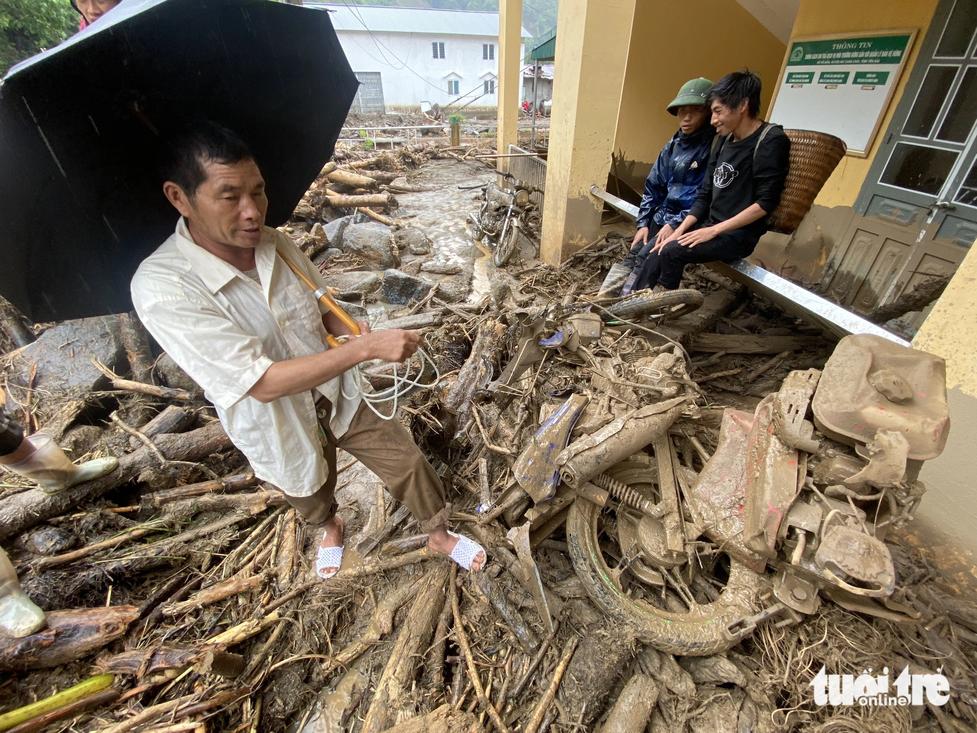 A motorbike and a plow after being damaged by flash floods. Photo: Chi Tue / Tuoi Tre