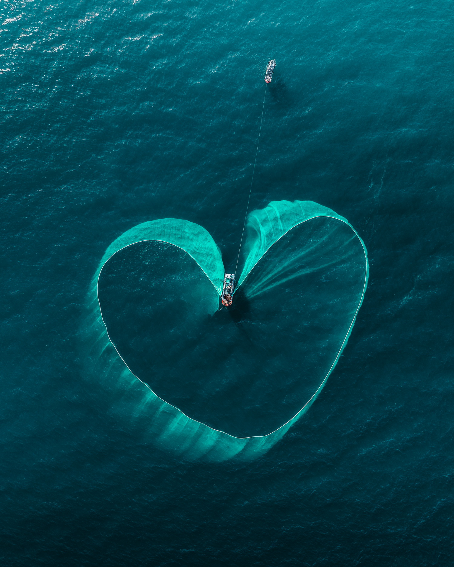 A bird's-eye view taken by Benjamin Tortorelli of farmers catching fish in Yen Islet, Phu Yen Province, central Vietnam.