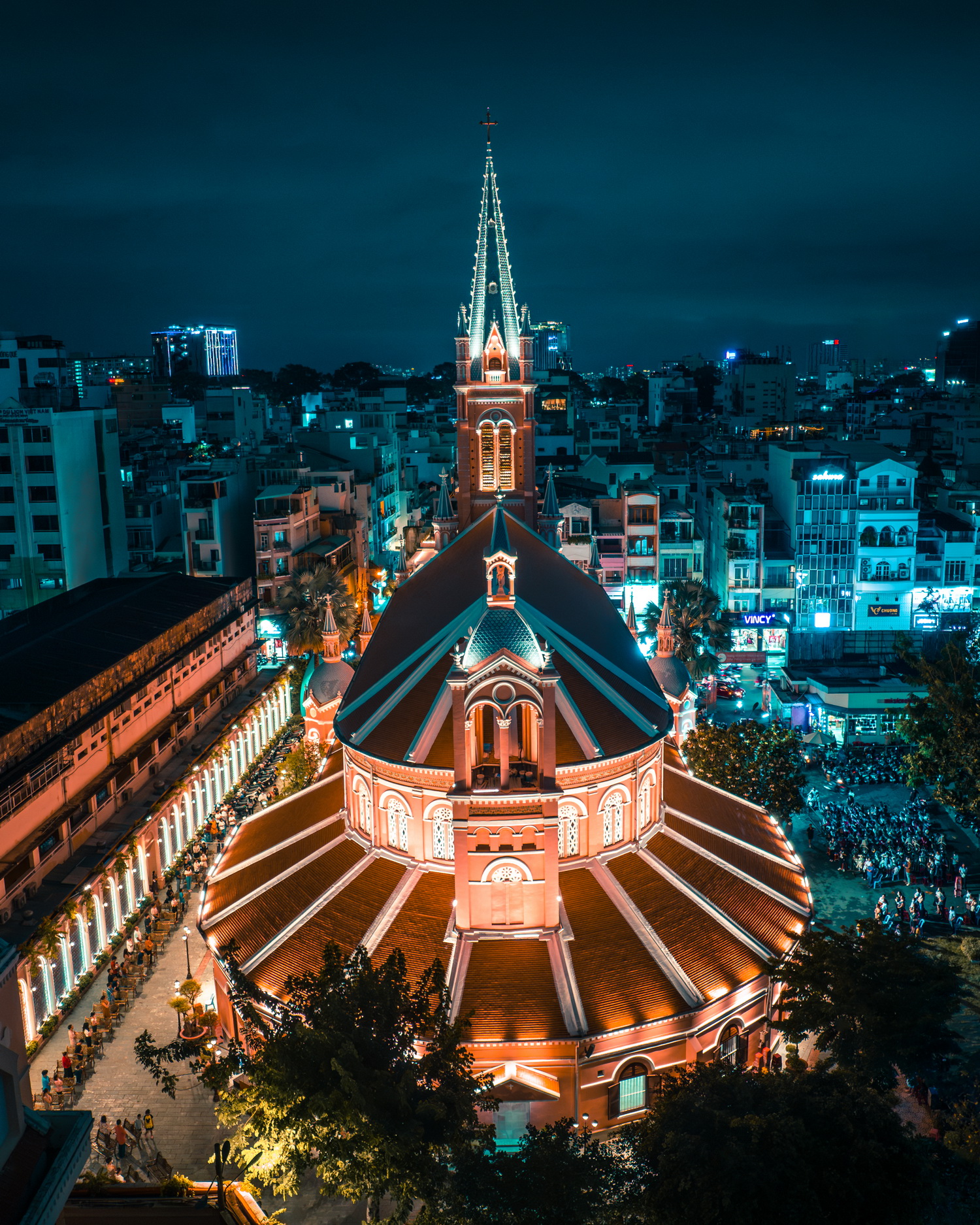 A photo by Benjamin Tortorelli capturing Tan Dinh Church in Ho Chi Minh City at night.
