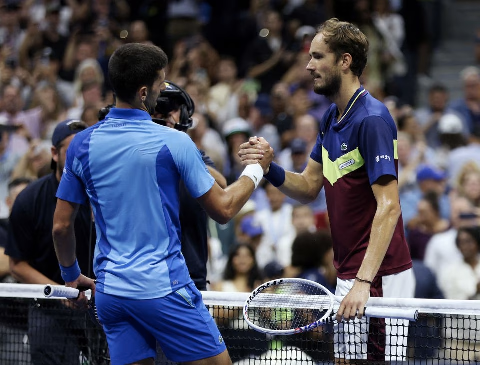 Tennis - U.S. Open - Flushing Meadows, New York, United States - September 10, 2023 Serbia's Novak Djokovic greets Russia's Daniil Medvedev after winning their final match. Photo: Reuters