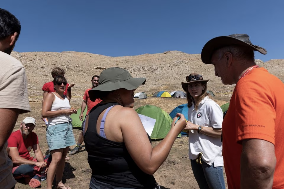 Jessica Van Ord, girlfriend of U.S. caver Mark Dickey, listens as she is informed about the latest developments of the rescue operation, by a group of Italian rescuers, to reach Dickey who fell ill and became trapped some 1,000 meters (3,280 ft) underground, near Anamur in Mersin province, southern Turkey September 10, 2023. Photo: Reuters