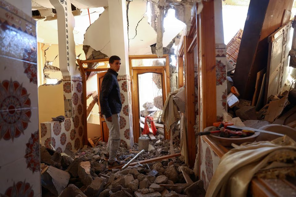 Mouath Aytnasr, 20, who lost his 7-year-old brother Suleiman in the earthquake, walks on the rubble of his damaged house, in a hamlet on the outskirts of Talat N'Yaaqoub, in the aftermath of Morocco's deadliest earthquake September 11, 2023. Photo: Reuters