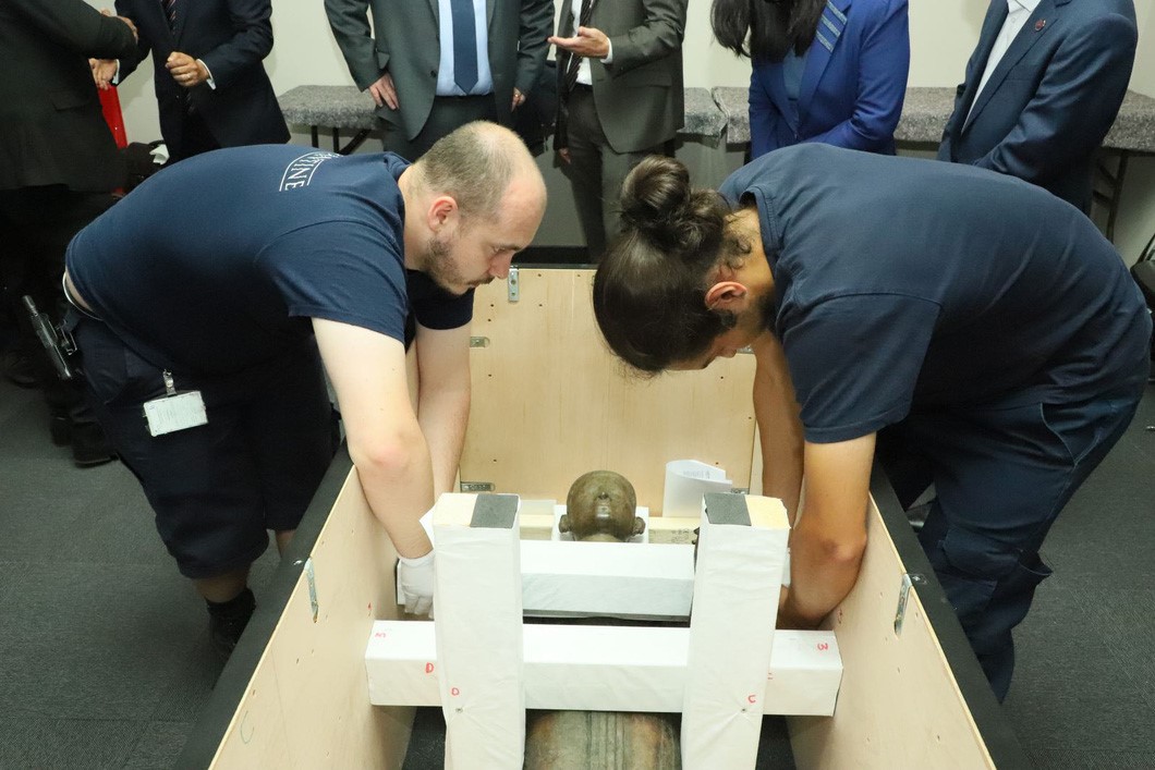 The statue is carefully wrapped up before being handed over to Vietnam.