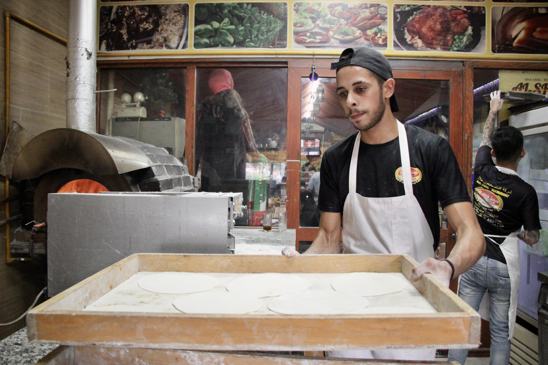 A baker prepares dough to make pita bread at Al-Sham Saigon. Photo: Dong Nguyen / Tuoi Tre News