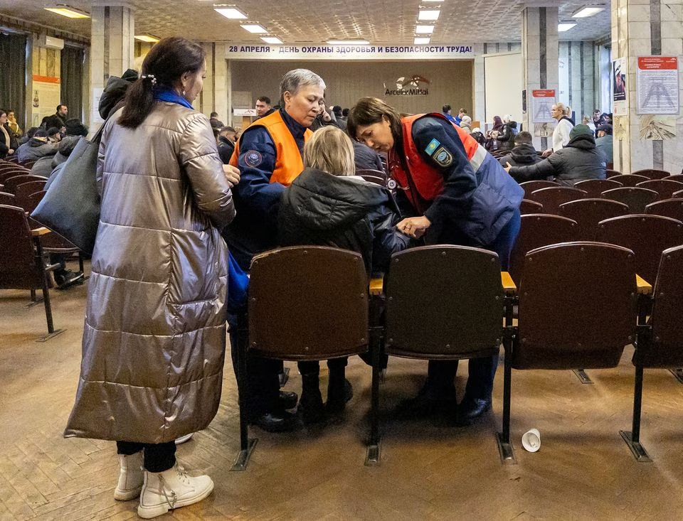 A woman is assisted at the Kostenko coal mine operated by ArcelorMittal Temirtau, as relatives of miners gather during a rescue operation following a mine fire, in Karaganda, Kazakhstan October 28, 2023. Photo: Reuters