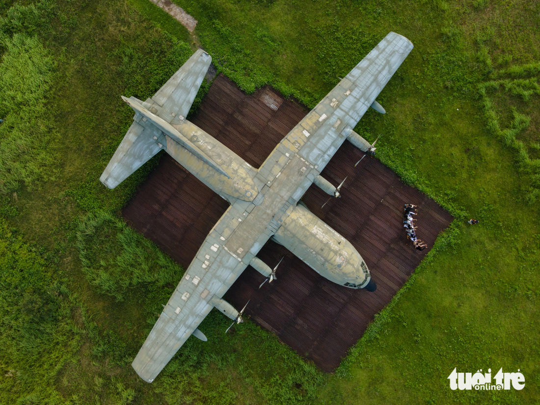 The tour ends at the Ta Con airport relic site where a C-130 military plane is placed as a connection of the past, the present, and the future. Photo: Hoang Tao / Tuoi Tre