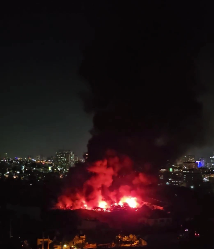 The warehouse fire pictured raging in District 7, Ho Chi Minh City. Photo: Tran Ha / Tuoi Tre
