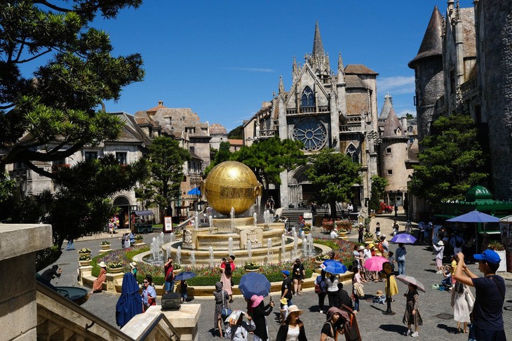 Tourists visit Ba Na Hills, a popular tourist site in Da Nang City.