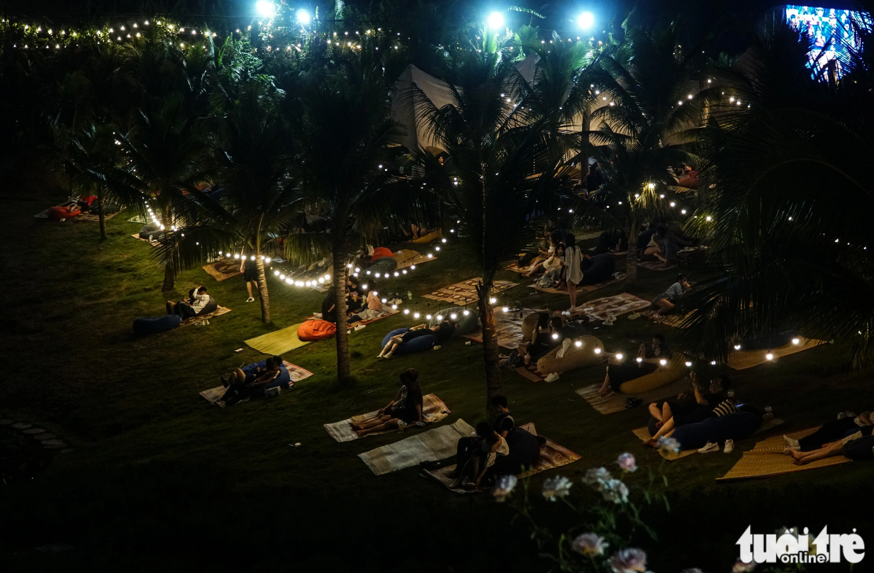 Young people in Hanoi rush to a 24/7 cafe near West Lake to enjoy an airy and restful space. Photo: Nguyen Hien / Tuoi Tre