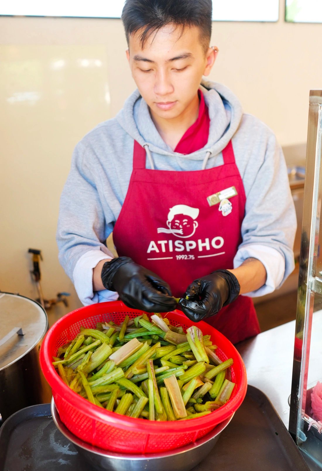 Artichoke leaf sheaths are prepared before being used to cook pho. Photo: M.V