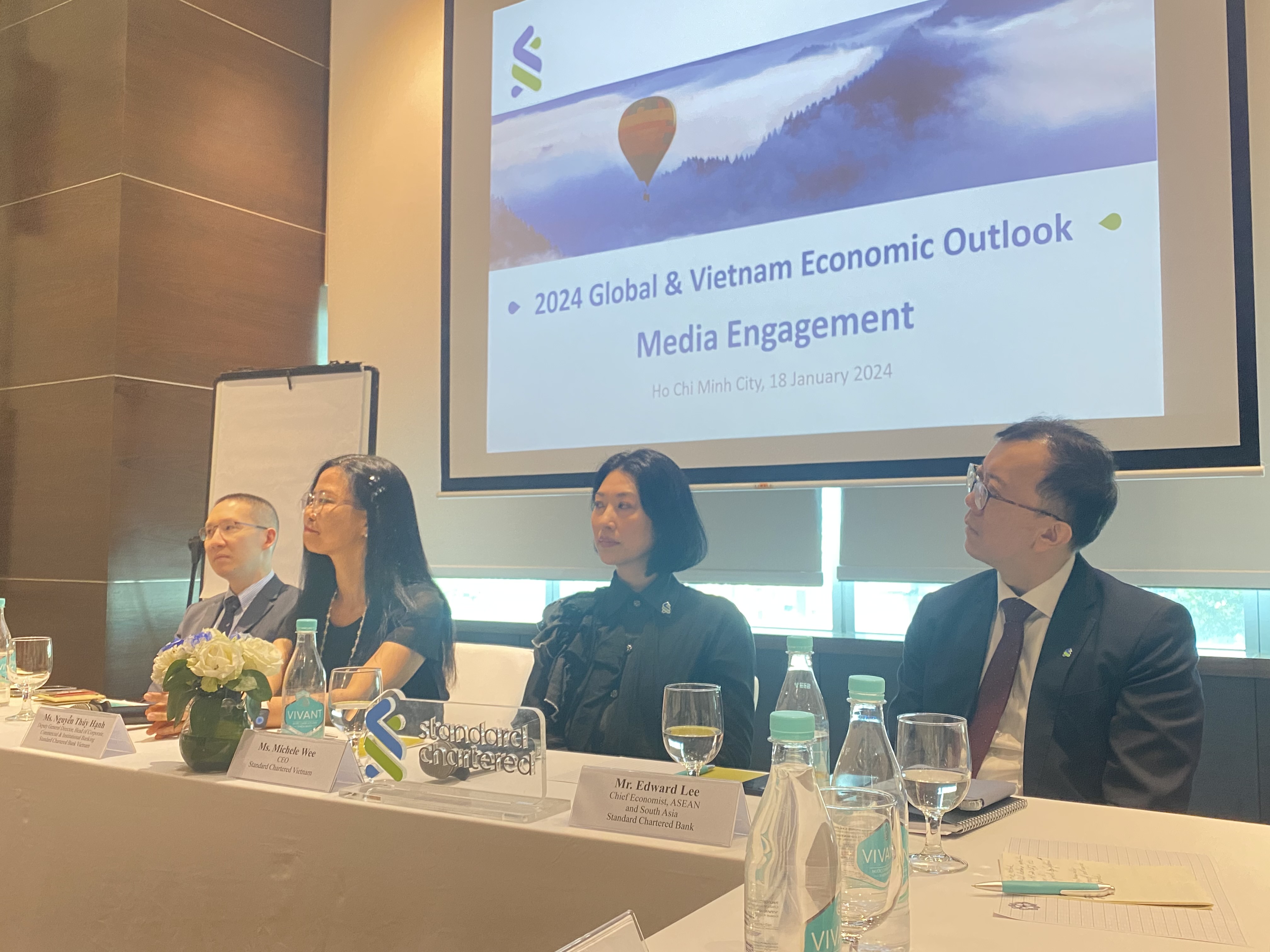 From left: Tim Leelahaphan, economist for Vietnam and Thailand at Standard Chartered Bank; Nguyen Thuy Hanh, deputy general director, head of corporate, commercial & institutional banking at Standard Chartered Bank; Michele Wee, CEO of Standard Chartered Bank; and Edward Lee, chief economist for ASEAN and South Asia at Standard Chartered Bank, address a media engagement in Ho Chi Minh City, January 18, 2024. Photo: Thanh Ha / Tuoi Tre News