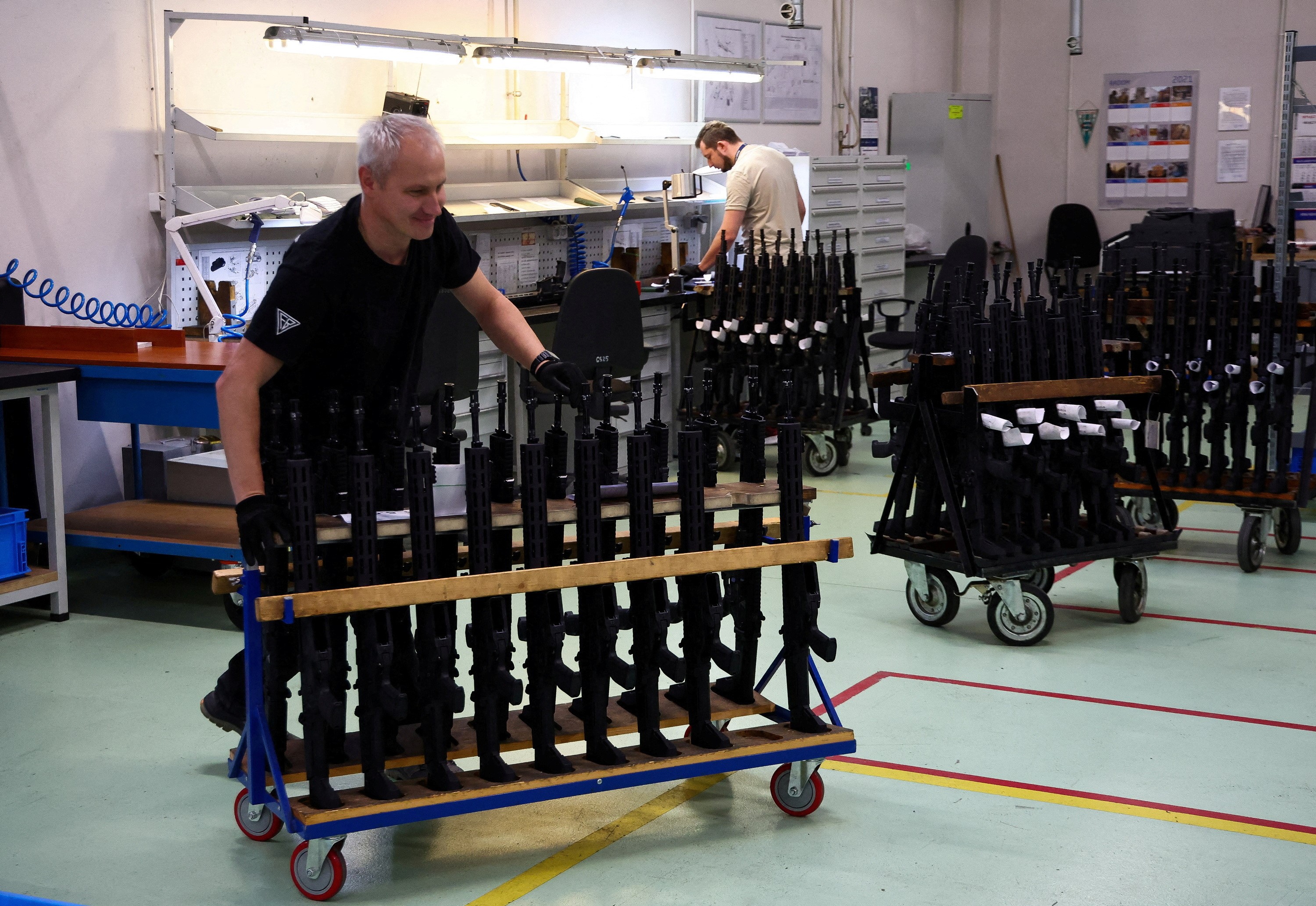 A worker pushes the trolley with GROT C16 FB-M1, modular assault rifles system at PGZ (Polska Grupa Zbrojna) arms factory Fabryka Broni Lucznik in Radom Poland, November 7, 2022. Photo: Reuters